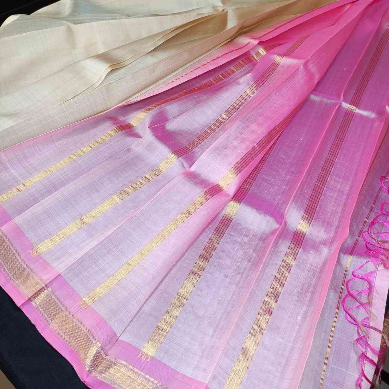 Serene ivory Thirubhuvanam silk saree showing elegant drape and simplicity