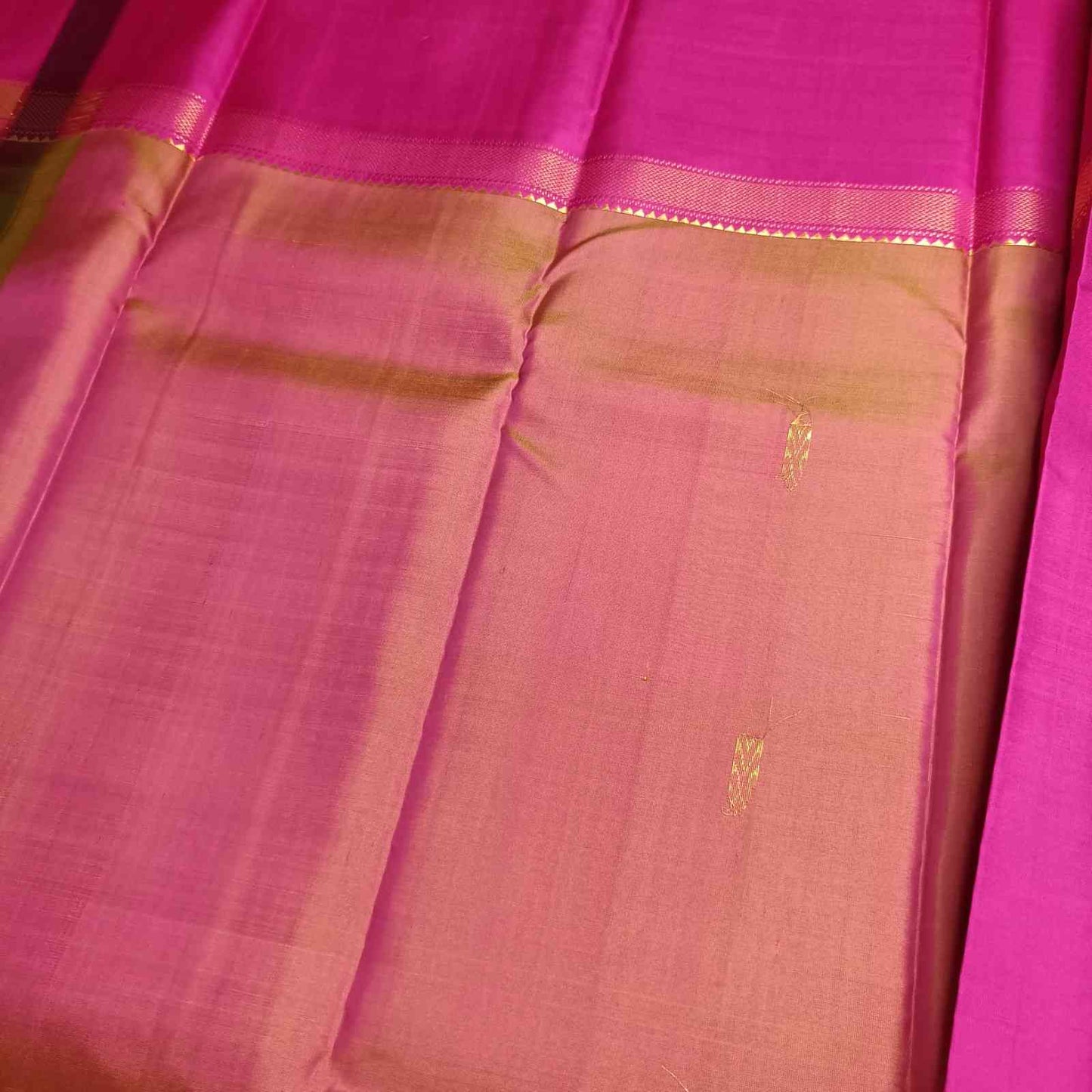 Pure mulberry silk Kanjivaram fabric showing 650g premium handloom weave quality showing back of the hand woven leaf motif
