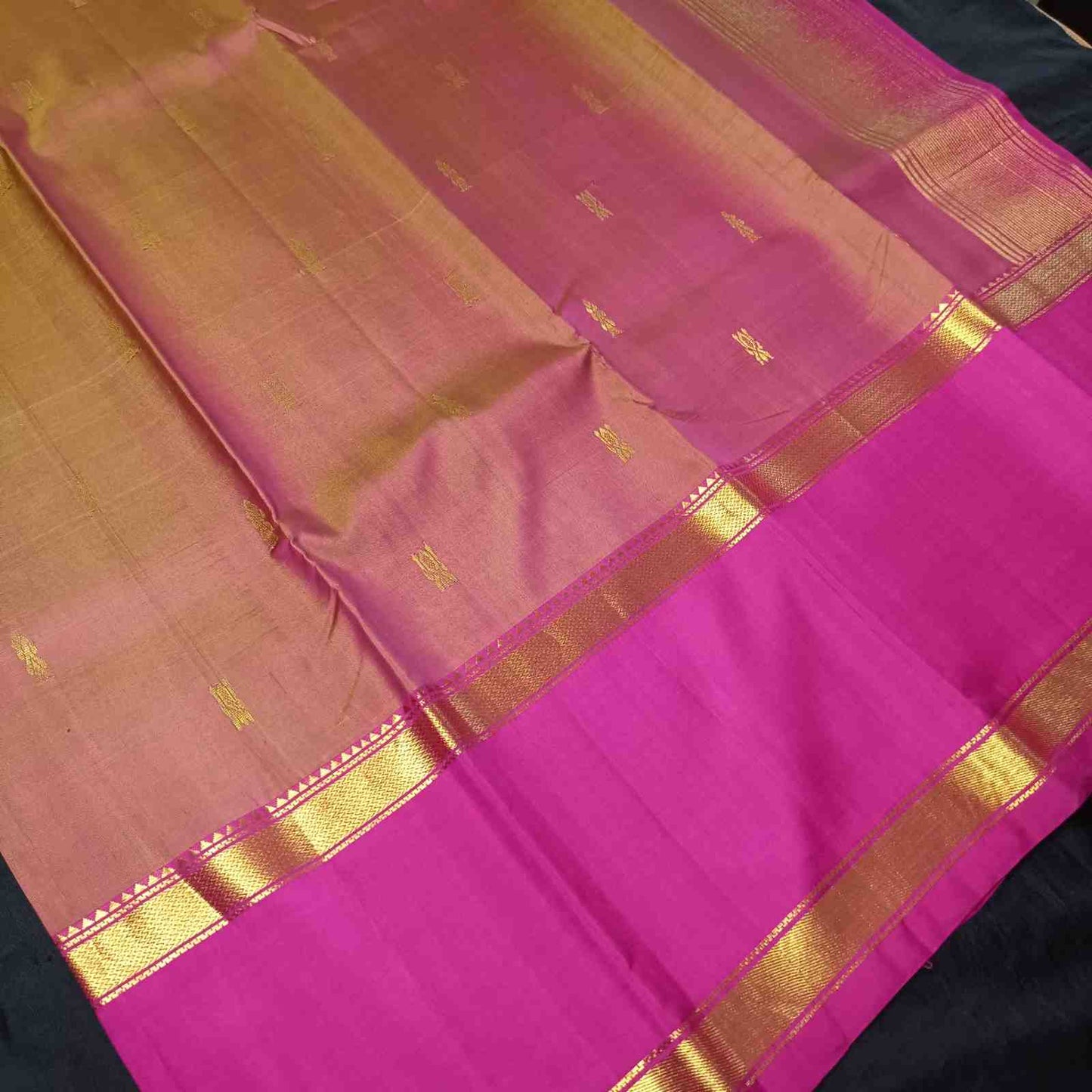 Close-up of traditional Korvai Reku Kaddi border on honey gold Kanjivaram silk saree
