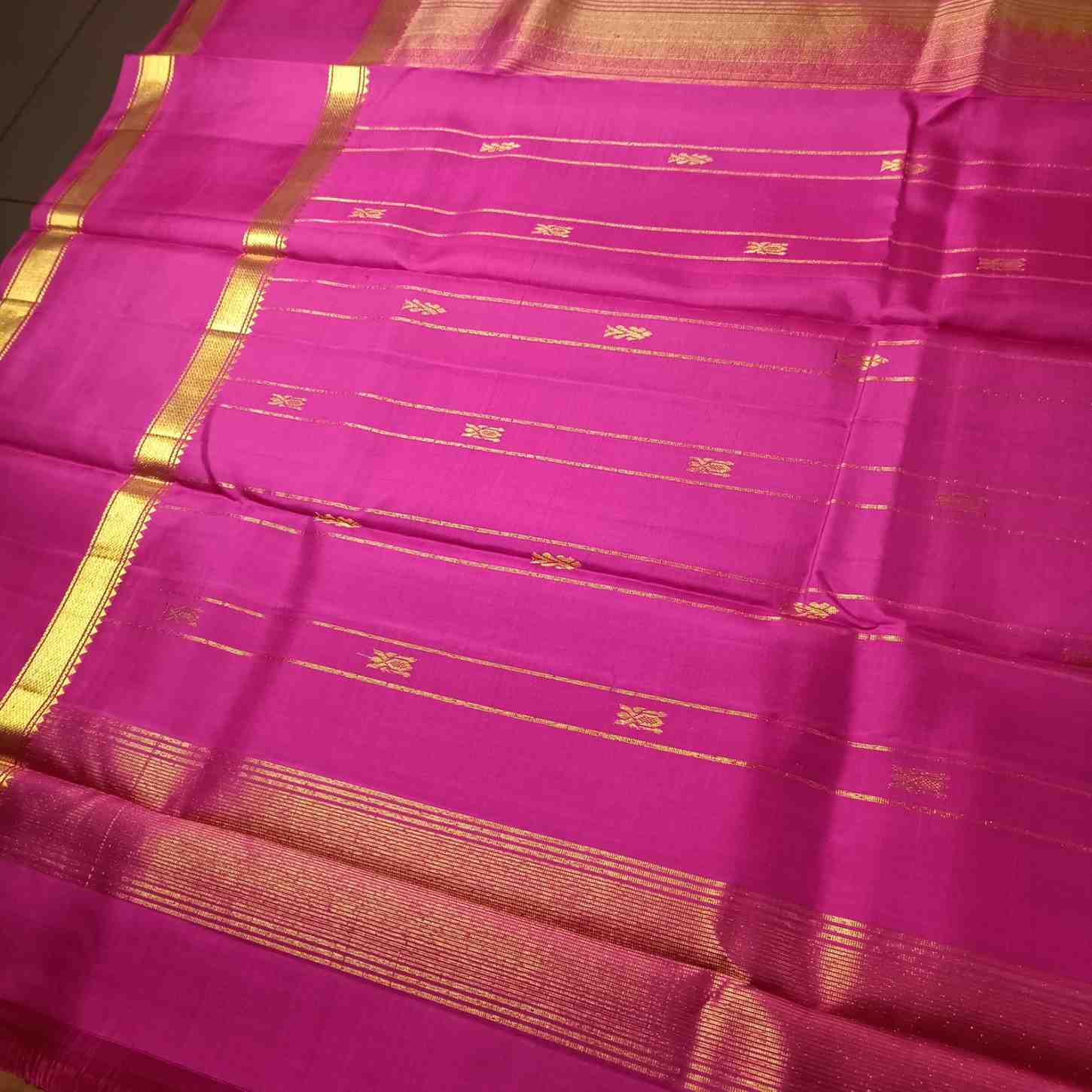 Honey gold Kanjivaram silk saree pallu with Chinna Butta motifs and golden zari
