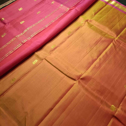 Pure silk Kanjivaram fabric showing earthy Kavi rust orange temple tone