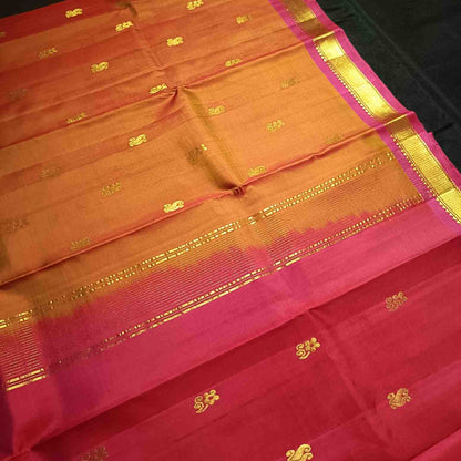 Pure handloom earthy rust orange Kanjivaram silk saree with Bhavanji border full view