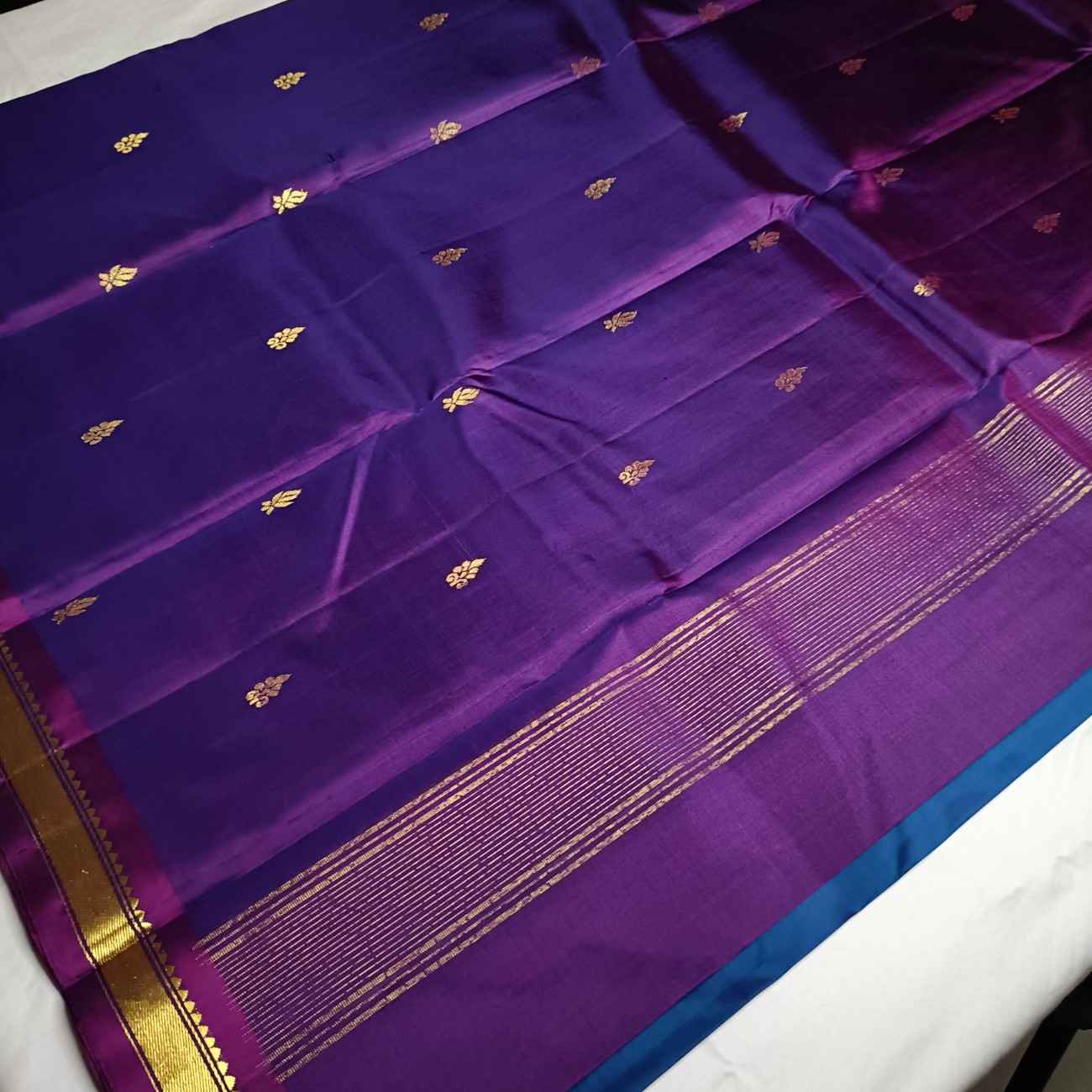 Contrast purple blouse piece with MS Blue Kanjivaram silk saree