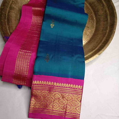 Pure handloom Rama Green Thirubhuvanam silk saree with pink korvai border 