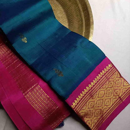 Pure handloom Rama Green Thirubhuvanam silk saree with pink korvai border 