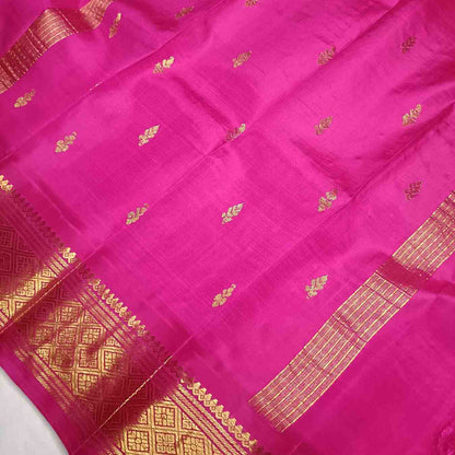 Rama Green and pink pallu with thin zari lines and small buttas  on Thirubhuvanam silk saree