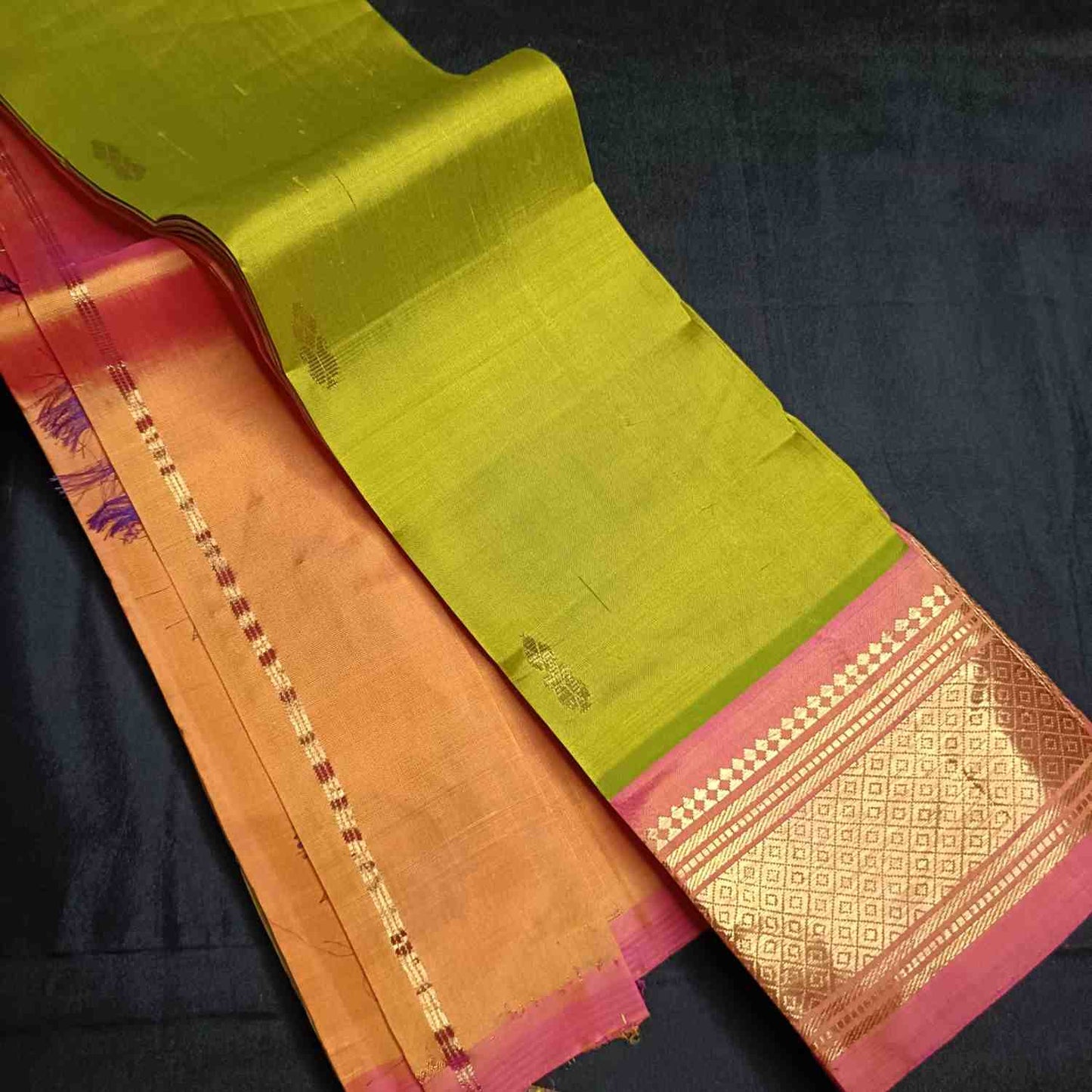 Orange-pink contrast border detail on Sneha Green Thirubhuvanam silk saree