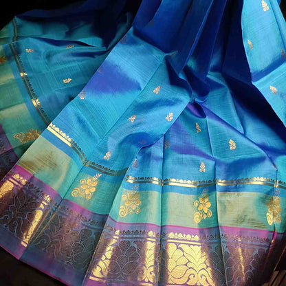 Pure handloom Thirubhuvanam silk saree in dual tone peacock blue with violet flower zari border, antique zari manga and floral motifs, 5.28m no blouse