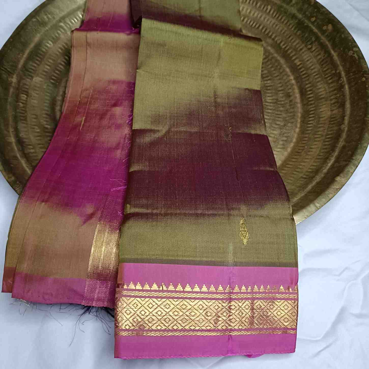 Pure handloom Olive Green Thirubhuvanam silk saree with pink Temple border 