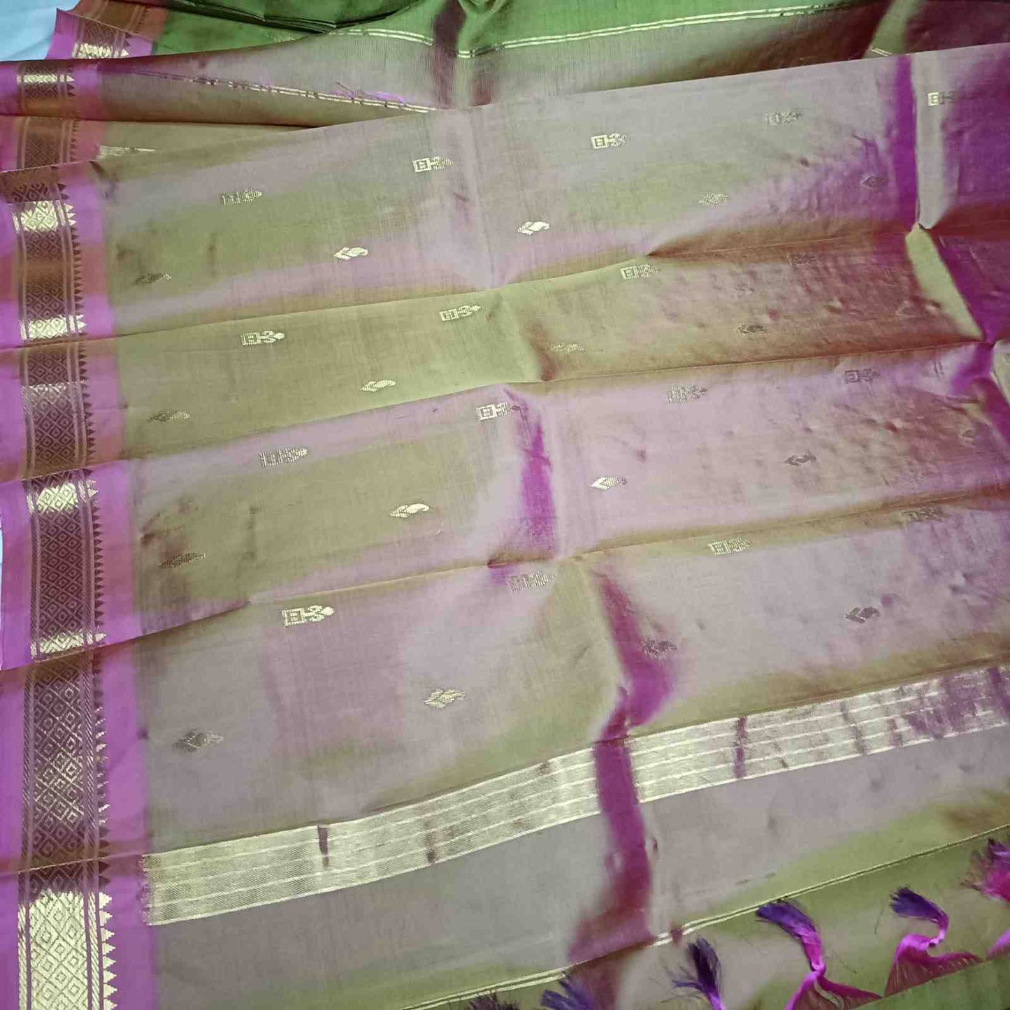 Dual Shade Olive Green and pink pallu with thin zari lines and small buttas  on Thirubhuvanam silk saree
