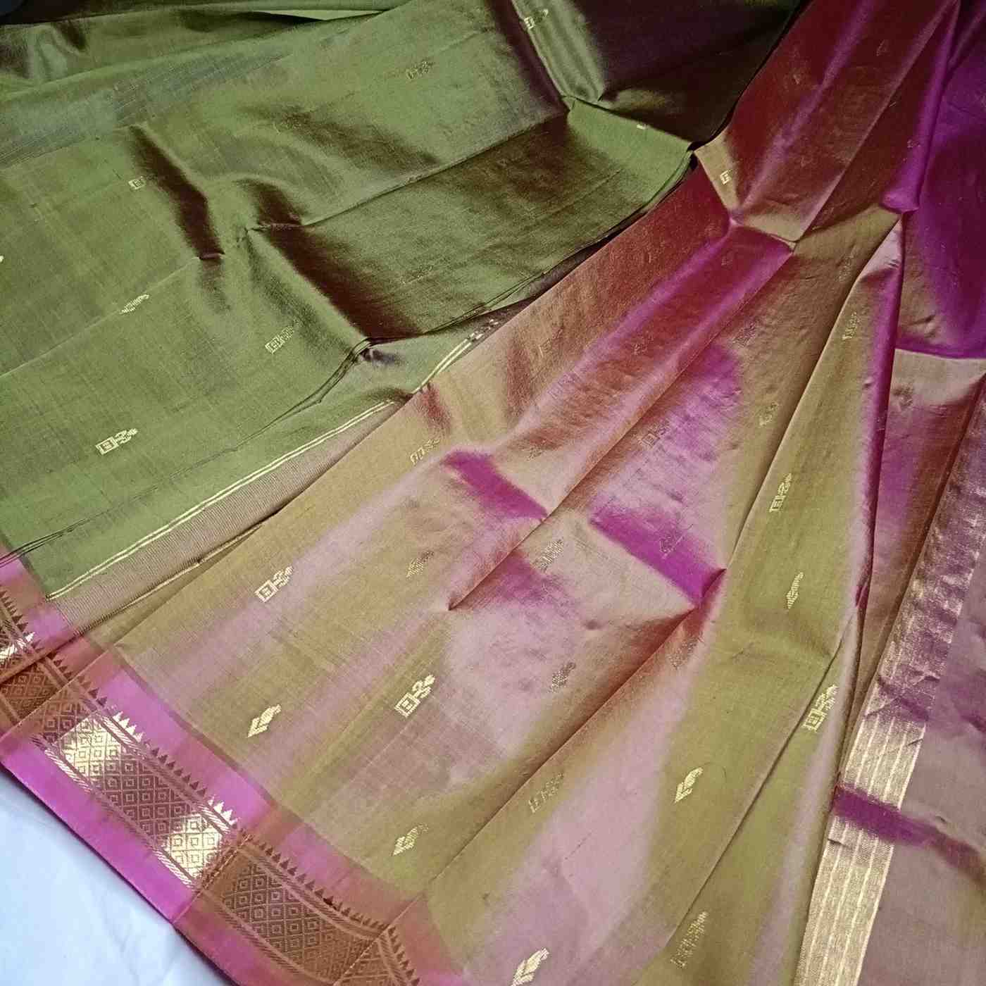 Dual Shade Olive Green and pink pallu with thin zari lines and small buttas  on Thirubhuvanam silk saree