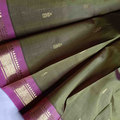 Close-up of pink Temple border on olive green Thirubhuvanam silk saree