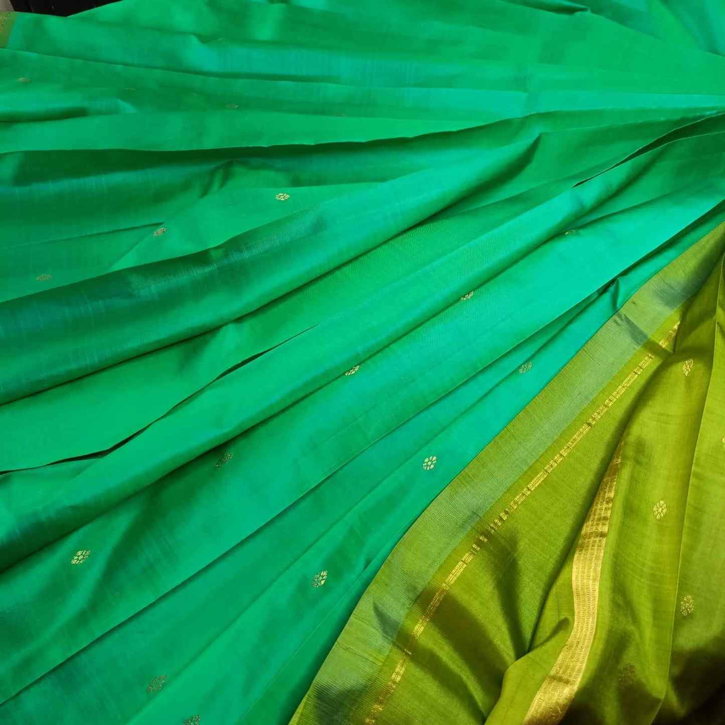 Close-up of green fabric with a subtle pattern