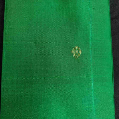 Green fabric with a small yellow pattern on a black background