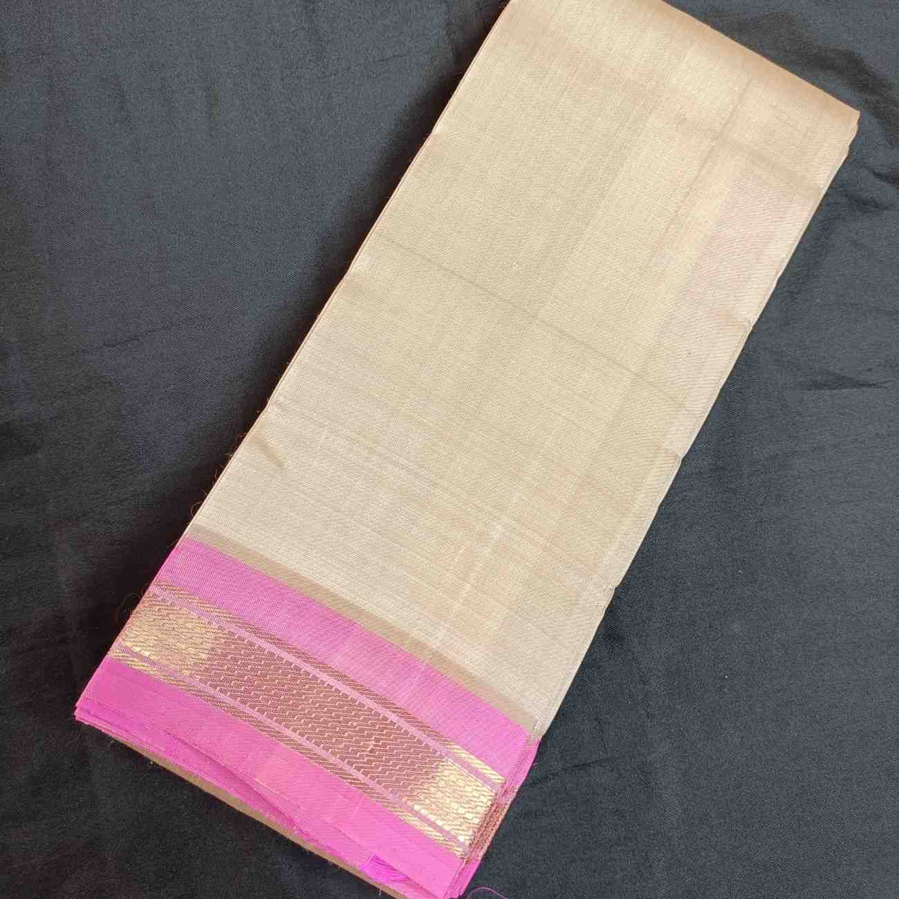 Ivory Thirubhuvanam silk saree plain body showing minimalist elegance

