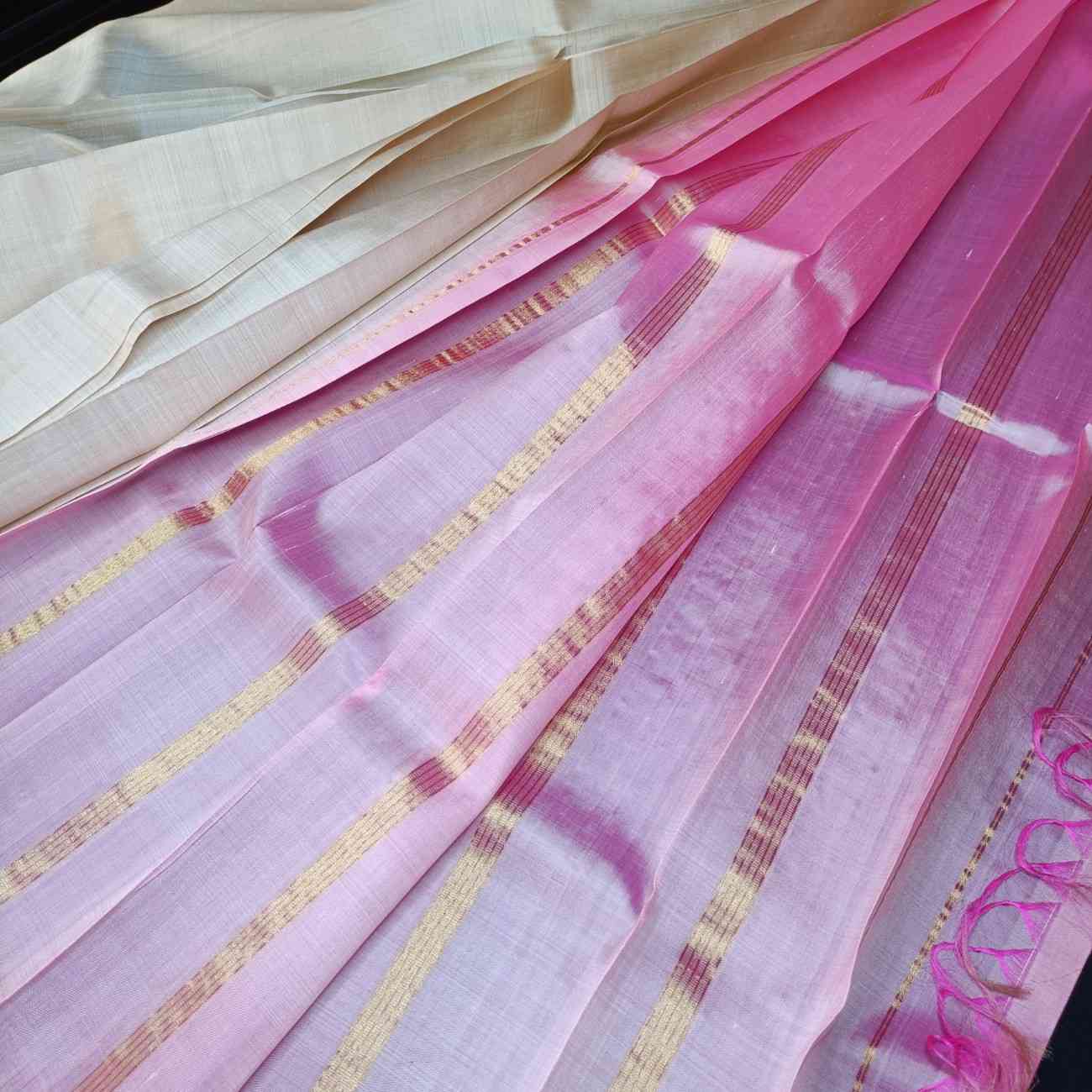 Serene ivory Thirubhuvanam silk saree showing elegant drape and simplicity