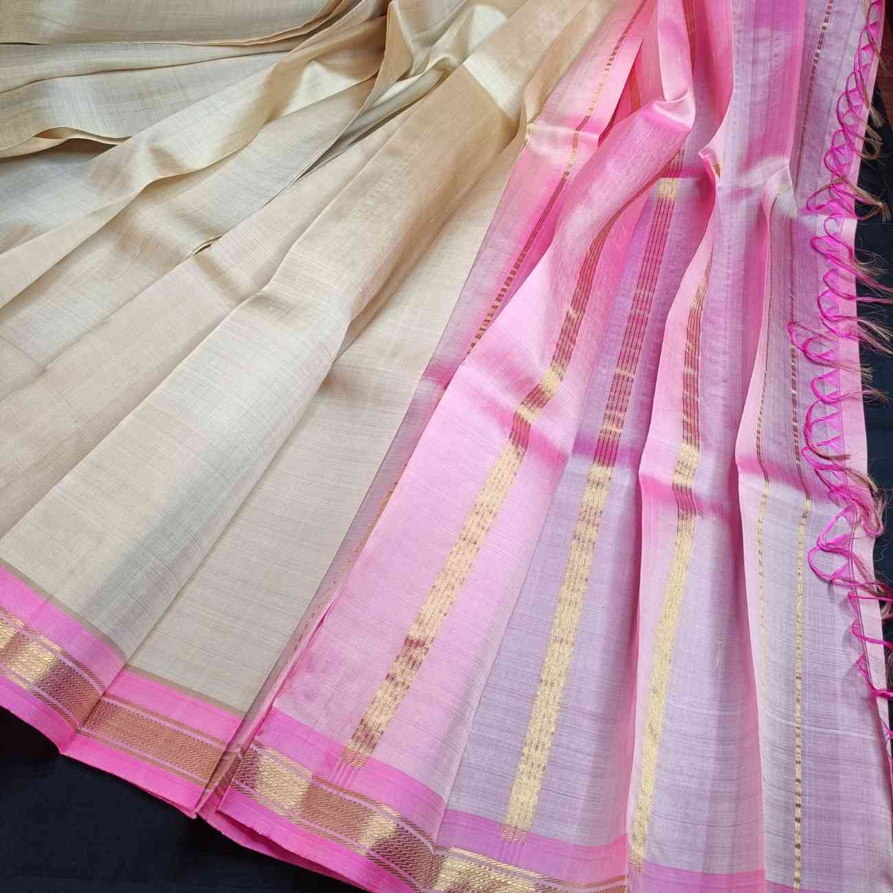 Ivory off-white Thirubhuvanam saree with lotus pink contrast border detail