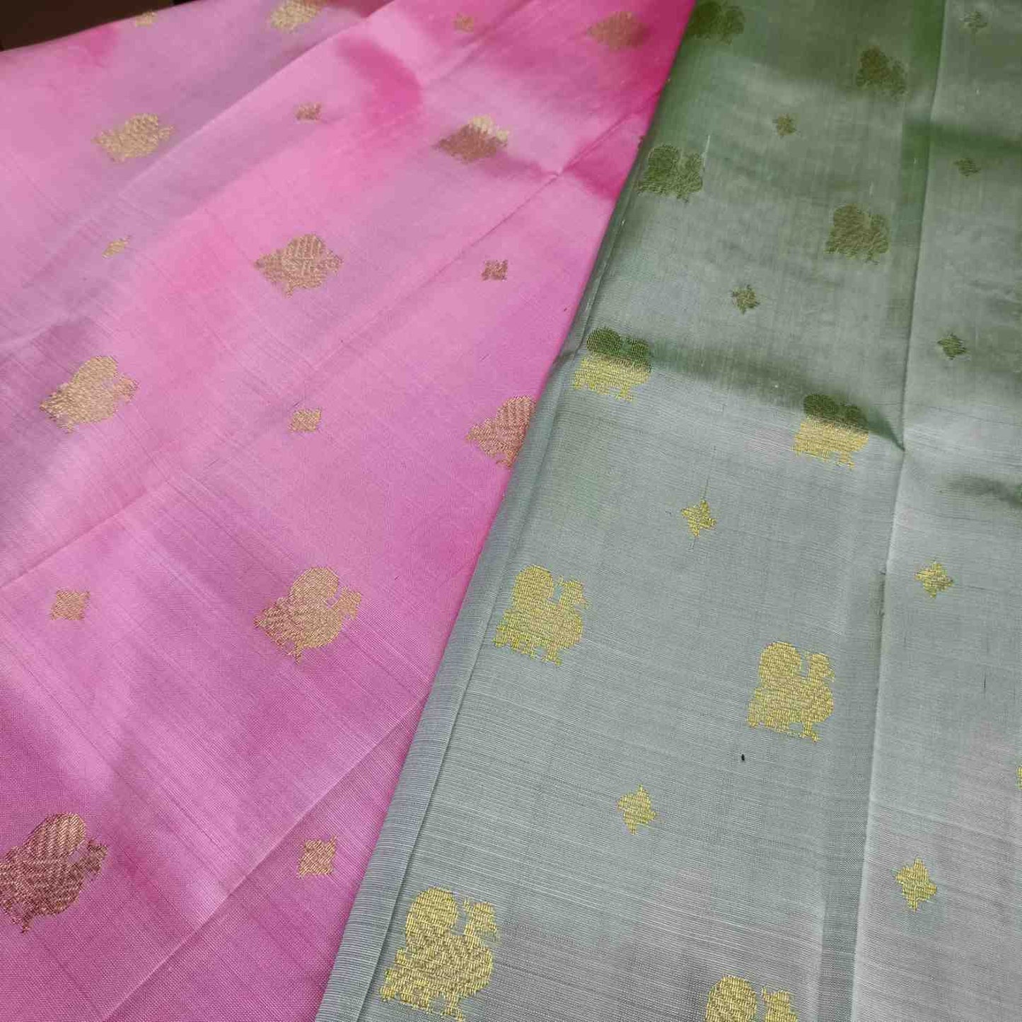 Close-up of traditional Annapakshi bird motif on pink Thirubhuvanam silk saree border
