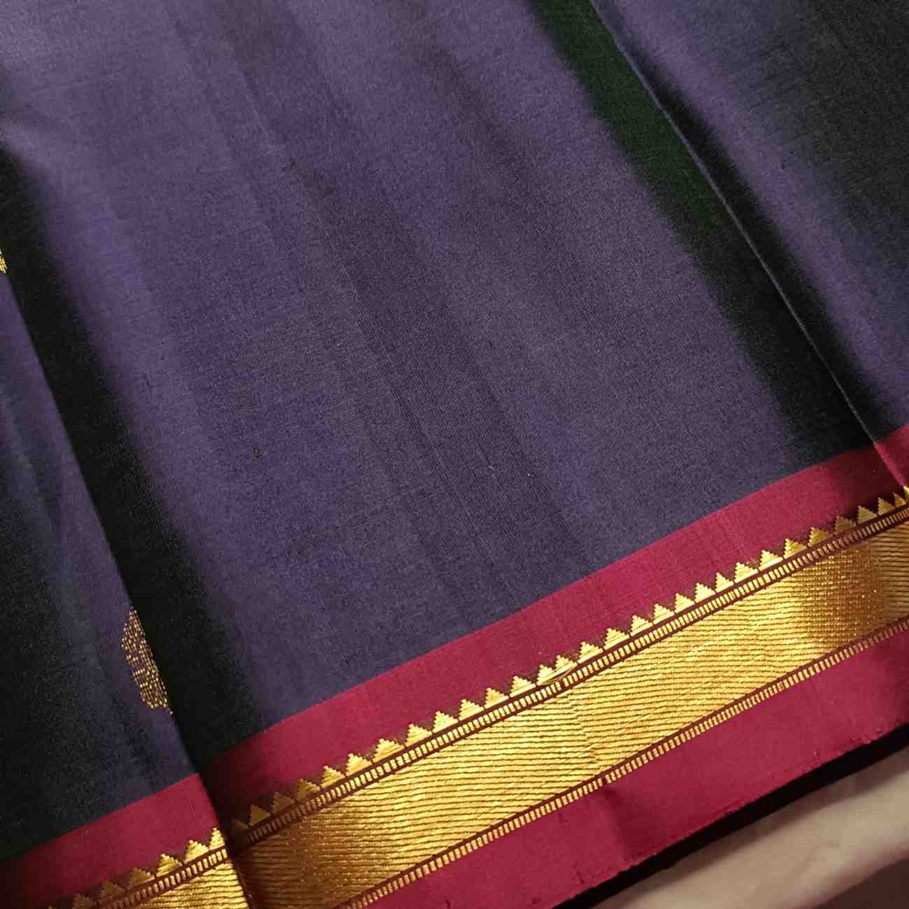  Close-up of contrast Arakku-Paaku wine temple border on navy blue Kanjivaram saree