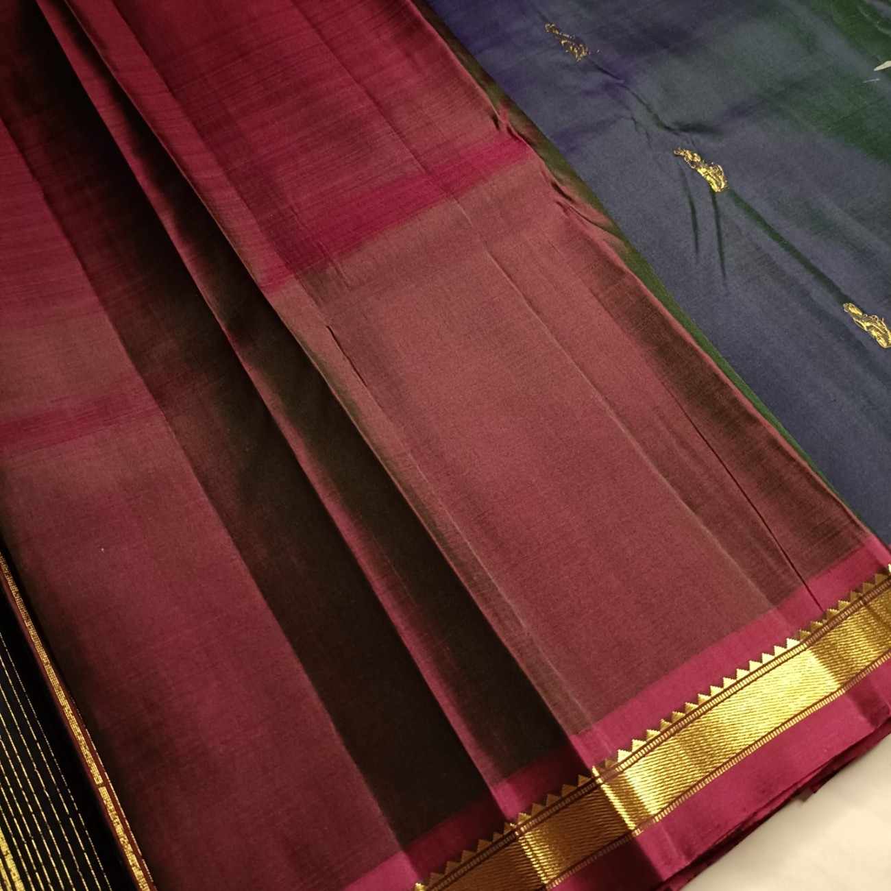Contrast wine blouse piece with navy blue Kanjivaram silk saree